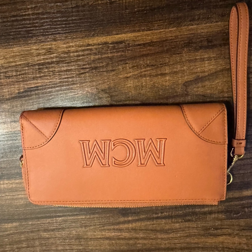 Authentic MCM Cognac Leather Wristlet Clutch with Embossed Logo